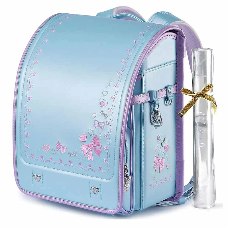 Elegant Randoseru with Heart & Bow Embroidery – Lightweight, Durable, and StylishLet your little one feel like a princess every day with the Coulomb School Bag, beautifully designed with heart and ribbon embroidery and crafted in a soft pale blue with a pearlescent finish.