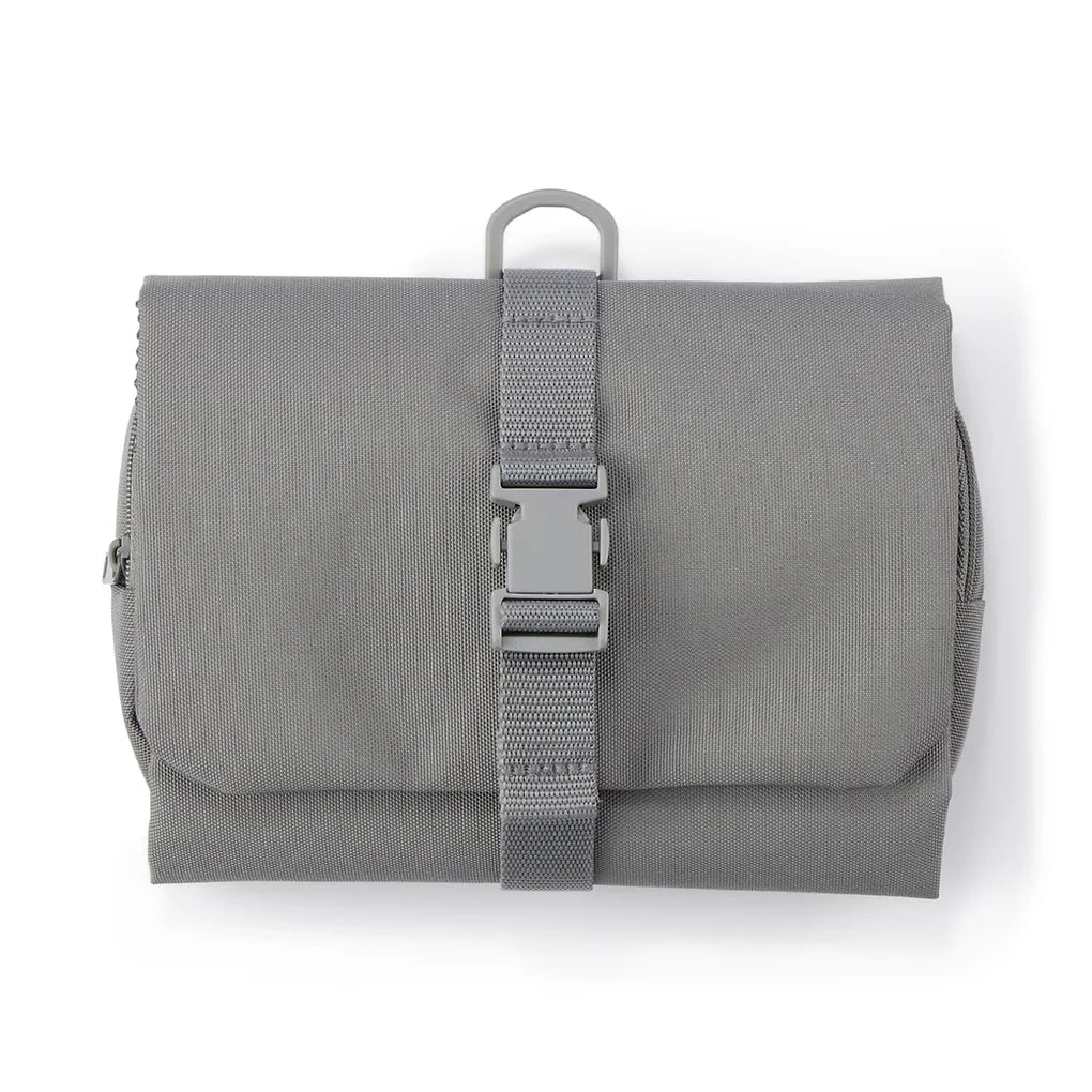 This practical case unfolds to hang easily on a bathroom hook or similar spot, keeping your essentials within reach.