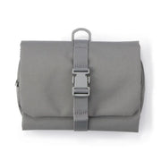 This practical case unfolds to hang easily on a bathroom hook or similar spot, keeping your essentials within reach.