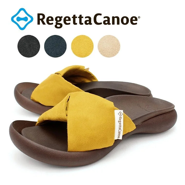 This elegant flat sandal features a stylish twisted strap design made of suede-like material, offering both comfort and a touch of sophistication.