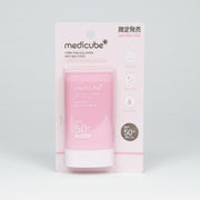 Pink sun stick with Medicube packaging on a white background